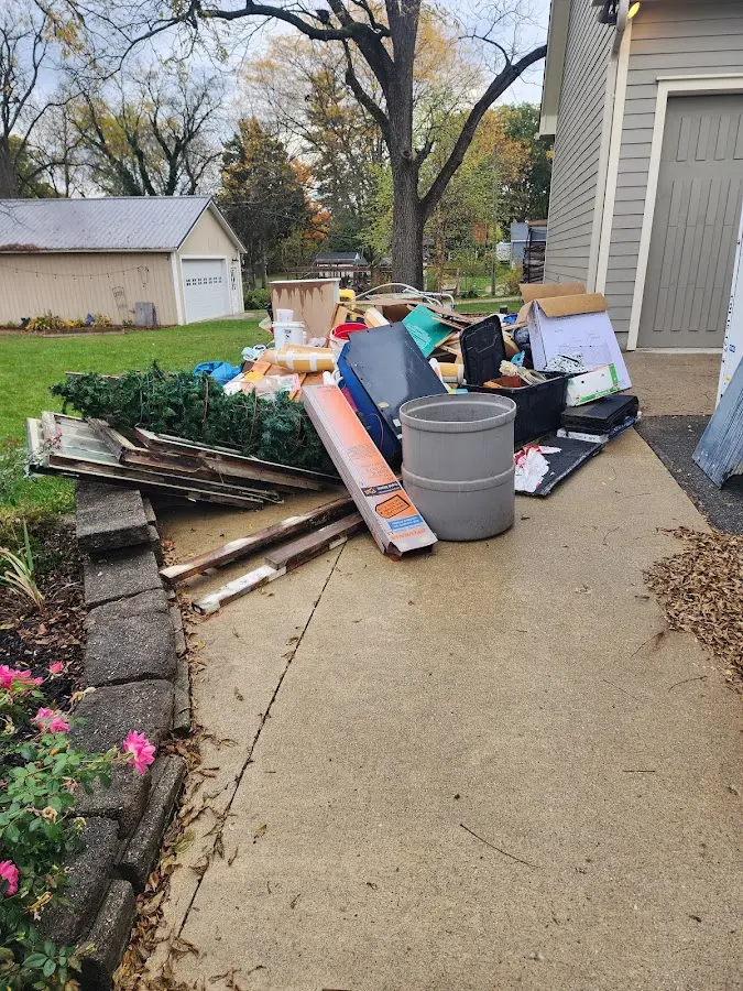 Dumpster being loaded with debris for 30 Yard Dumpster Rental in Charleston